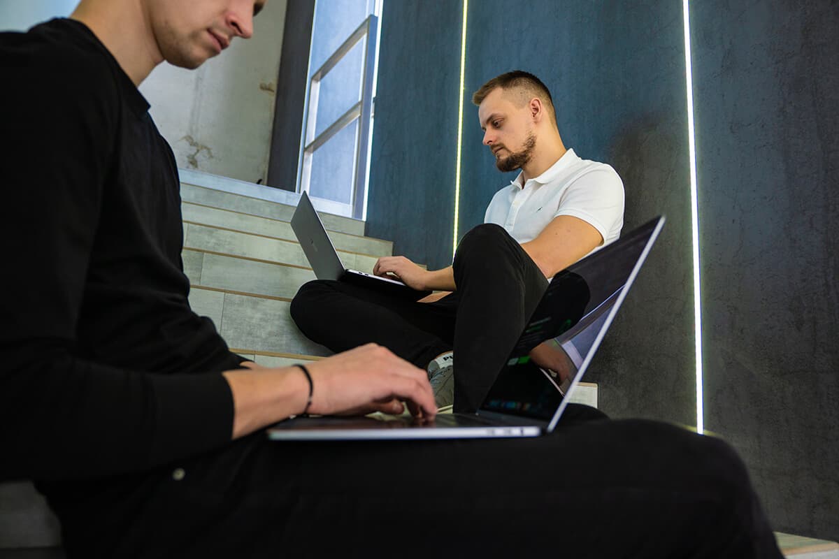 BrainCode developer coding on a laptop in the London studio