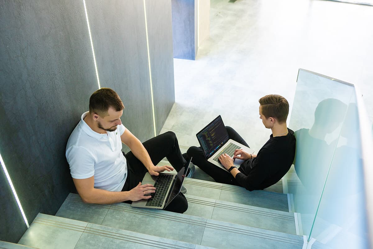 BrainCode engineer reviewing code on screen